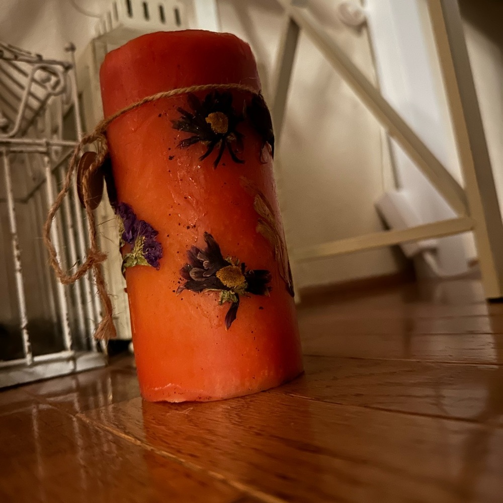 Candle with real spring flowers imbedded